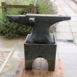 A large cast iron anvil on separate stand,