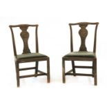 A pair of unusual carved chairs,