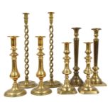 A pair of brass open twist candlesticks,