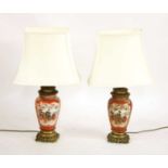 A pair of Satsuma and gilt metal mounted table lamps,