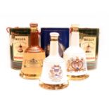 Assorted Bell's porcelain decanters: five commemorative decanters and one other, six in total