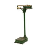Vintage green painted cast iron floor standing weighing scales