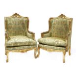 A pair of Louis XV-style gilt wood bergère chairs,