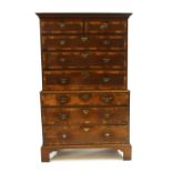A George III oak and mahogany crossbanded chest on chest