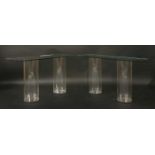 A pair of contemporary glass console tables,