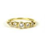 An 18ct gold five stone diamond ring