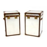 A pair of mirrored metal aviator trunks,