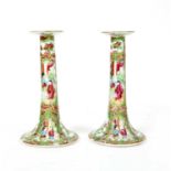 A pair of Canton famille vert enamelled candlesticks,