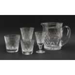 A collection of cut crystal glass