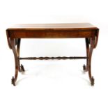 A 19th century German flame mahogany sofa table