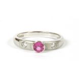An 18ct white gold single stone pink sapphire ring