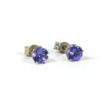 A pair of 9ct white gold single stone tanzanite earrings