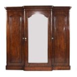 A mahogany breakfront triple wardrobe,