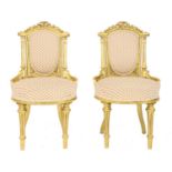 A pair of gilt side chairs,