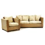 A wicker three seat sofa,