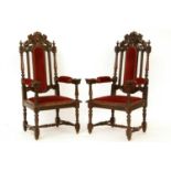 A pair of late 19th century carved oak throne chairs