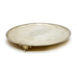 A circular silver salver,