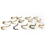 Thirteen Victorian-style cast brass coat hooks,