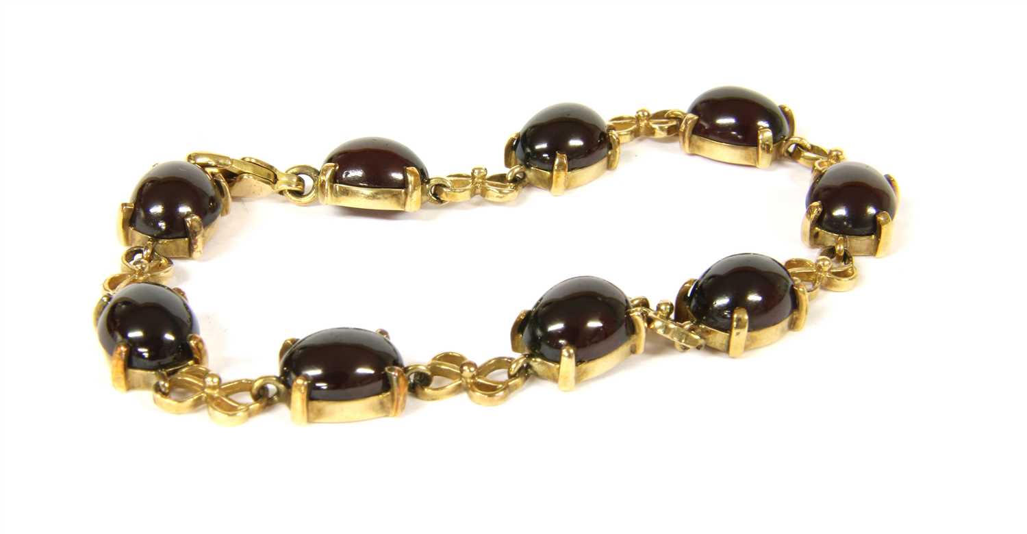 A 9ct gold cabochon garnet bracelet