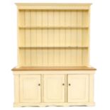 A pitch pine and painted dresser,