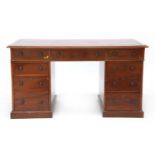 A Victorian mahogany nine-drawer twin pedestal desk,