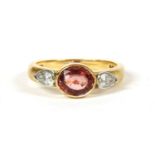 An 18ct rose gold and white gold single stone orange sapphire ring