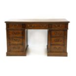An eighteen drawer oak partners desk,