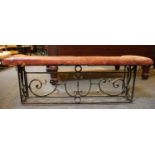 A wrought iron and leather upholstered club fender,