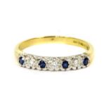 An 18ct gold sapphire and diamond half eternity ring,