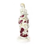 A Meissen stamped porcelain figure of a girl in a floral dress,