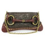 A Gucci caimen leather envelope clutch snaffle bag