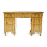 An Art Deco walnut twin pedestal desk,