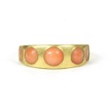 An 18ct gold coral five stone ring,