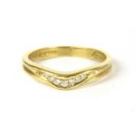 An 18ct gold diamond wishbone ring,
