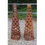 Two pierced steel obelisks,