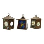 An Arts and Crafts copper lantern with multicoloured glazed panels,