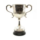 A silver twin-handled trophy,