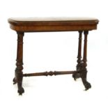 A Victorian inlaid walnut fold over card table,