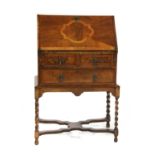 A late 19th century inlaid walnut miniature bureau,