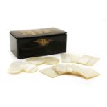 Approx. 139 mother of pearl gaming counters in lacquer box,