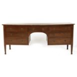 A mahogany and inlaid twin pedestal desk,