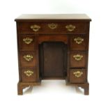 A mahogany kneehole desk,