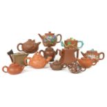 A collection of twelve Chinese Yixing Zisha teapots and covers,