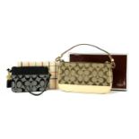 A coach canvas and leather handbag and purse