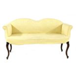 A yellow upholstered settee