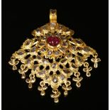 An Indian high carat gold, ruby and diamond pendant