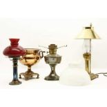 A group of four 19th century and later oil lamps,