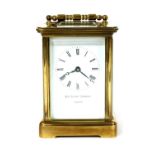 A brass cased carriage clock by Matthew Norman of London