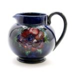 A William Moorcroft 'Anemone' pattern jug,