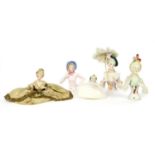 Five china pin cushion or powder puff dolls,